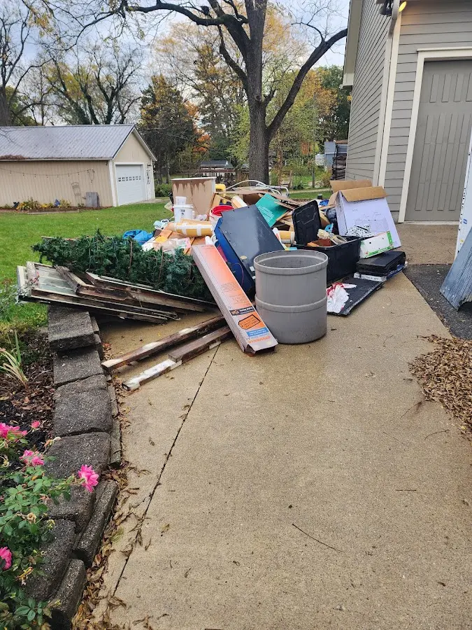Dumpster being loaded with debris for Estate Cleanout Dumpster Rental in Kelso